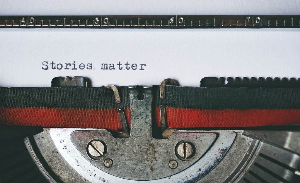 Typewriter ribbon with the text, “Stories matter.”