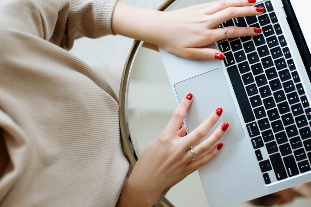 Photo of a woman accessing a nonprofit donor database on her laptop