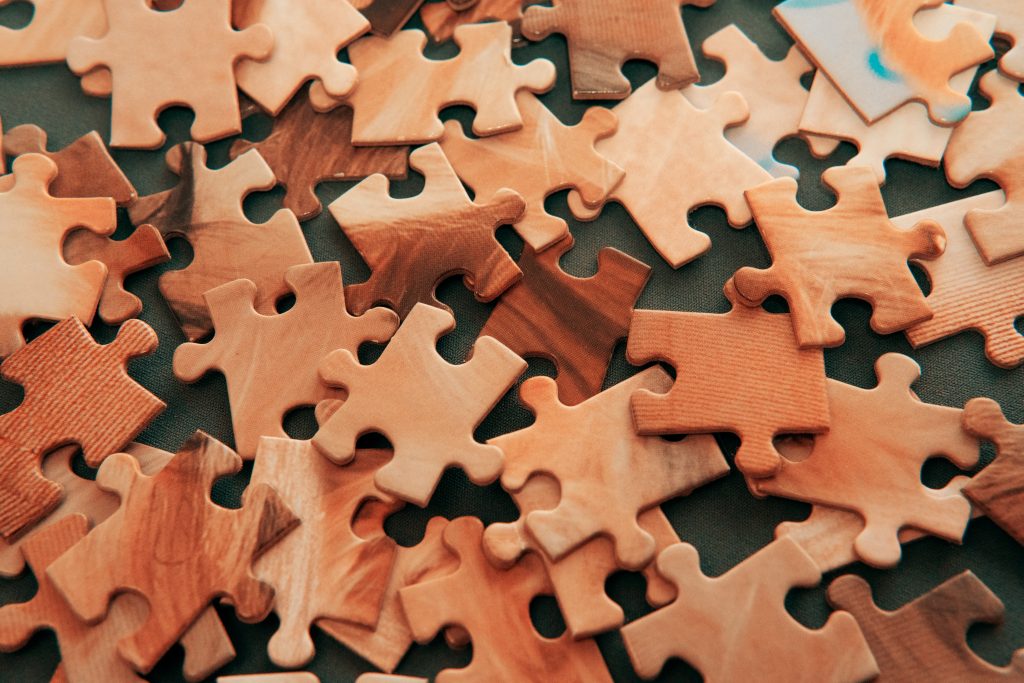 Brown puzzle pieces on table