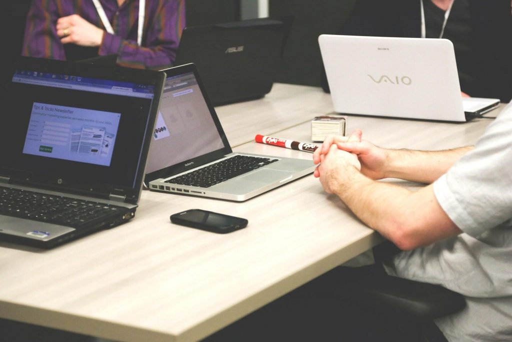 Business People at a Desk with Computers