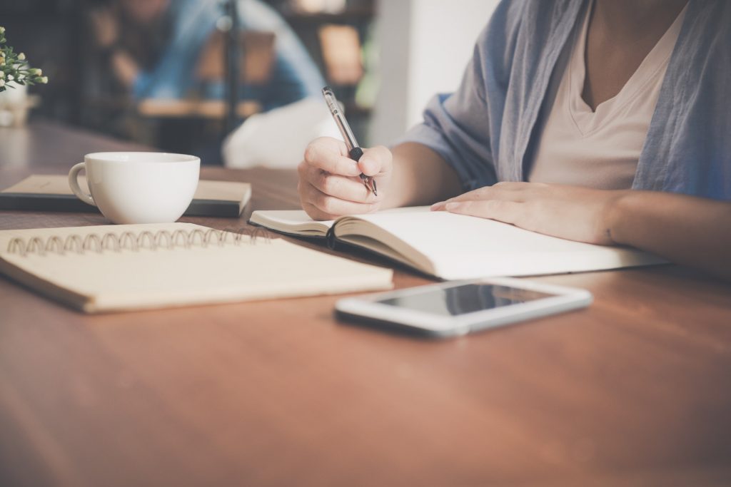 A woman sits at a desk learning what bylaws for a nonprofit are